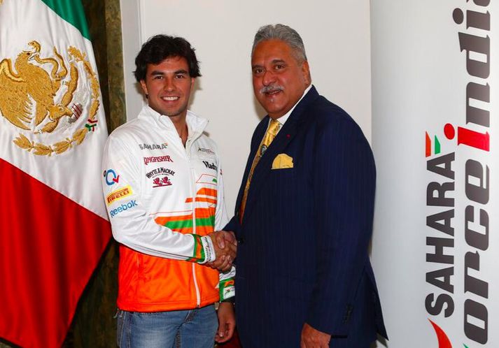 Sergio Perez við tilkynninguna í dag.