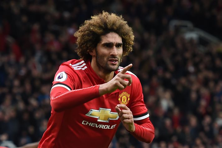 Fellaini fagnar marki með United á síðustu leiktíð.