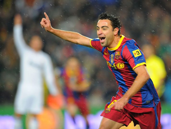 Xavi fagnar marki gegn Real.