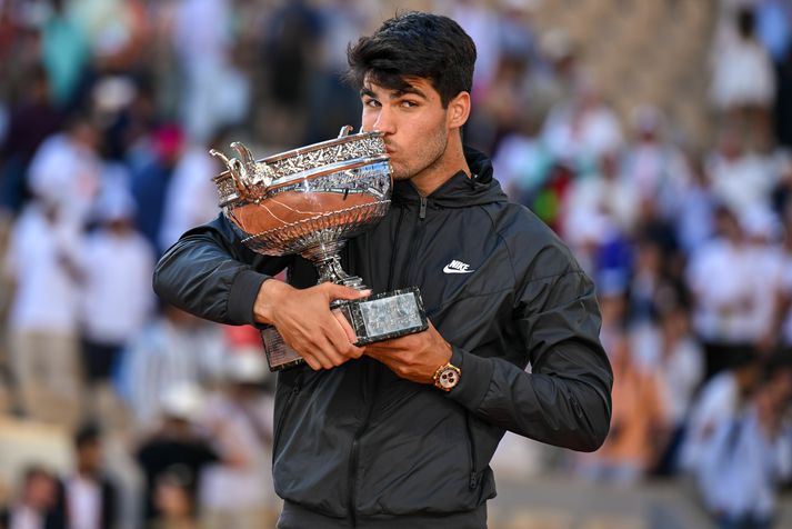 2024 French Open - Day 15 PARIS, FRANCE - JUNE 09: Carlos Alcaraz of Spain celebrates with the winners trophy after victory against Alexander Zverev of Germany in the Men's Singles Final match on Day Fifteen of the 2024 French Open at Roland Garros on June 09, 2024 in Paris, France. (Photo by Franco Arland/Getty Images)