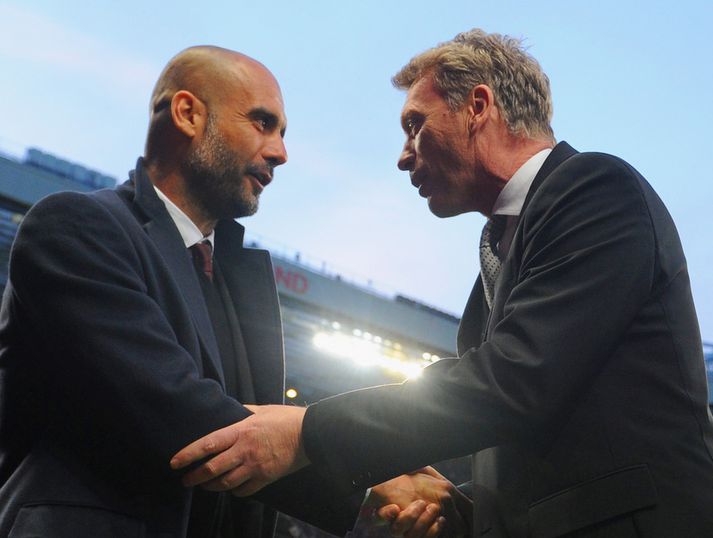 Pep Guardiola og David Moyes takast í hendur fyrir leik.