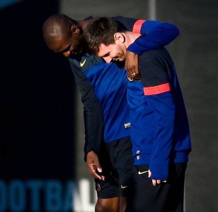 Eric Abidal og Lionel Messi á æfingu Barcelona.