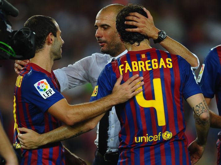 Pep Guardiola, þjálfari Barcelona fagnar þeim Cesc Fabregas og Javier Mascherano í gær.