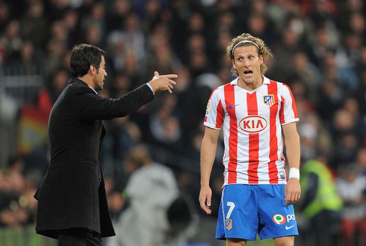 Forlan og Flores þjálfari.