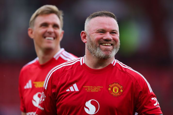 Wayne Rooney var laufléttur í bragði á Old Trafford í gær.