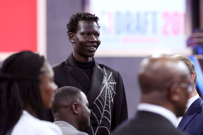 Darren Rovell on X: In honor of Bol Bol getting drafted, here are the best  pictures of his late father Manute Bol: In a swimming pool, with teammate Spud  Webb, in perspective
