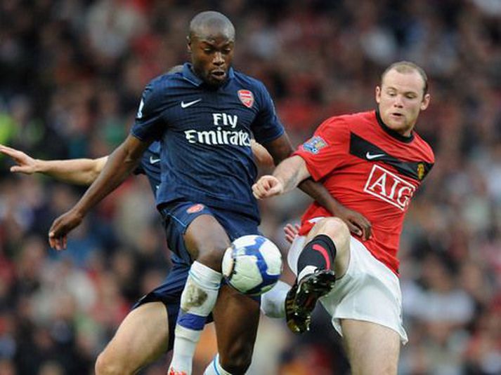 Gallas í baráttu við Wayne Rooney.