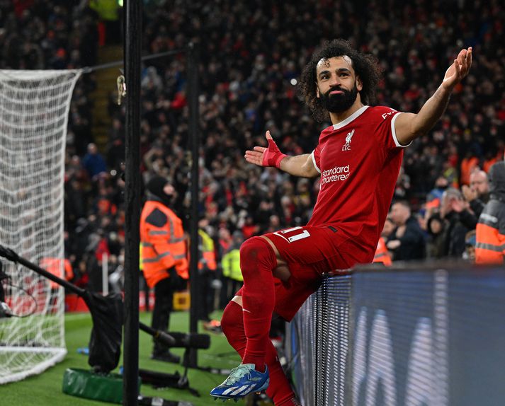 Mohamed Salah fagnar hér marki sínu á móti Newcastle í síðasta leik sínum fyrir Liverpool í bili.