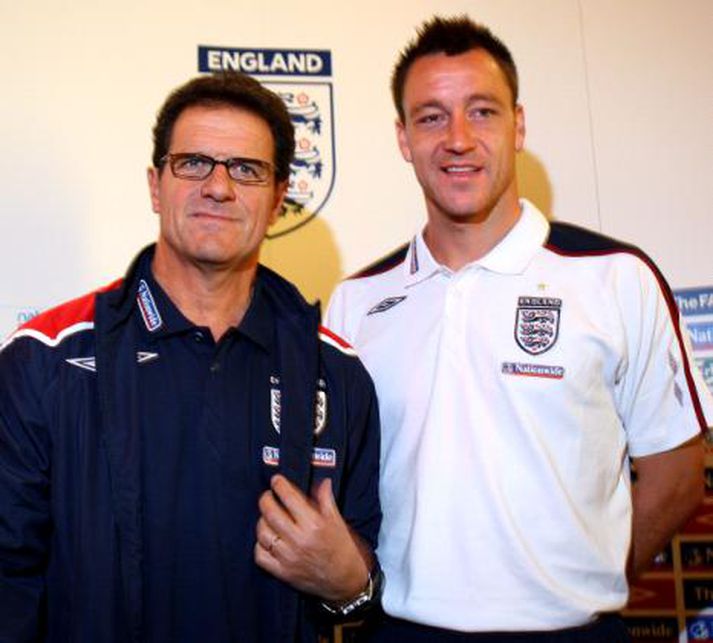 Fabio Capello og Rio Ferdinand.