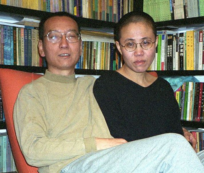 Liu Xiaobo og kona hans hafa bæði mátt þola frelsissviptingu sökum skoðana sinna. NordicPhotos/AFP