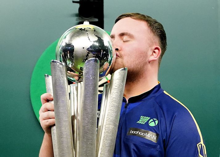 2024/25 Paddy Power World Darts Championship - Alexandra Palace - Final Luke Littler kisses The Sid Waddell Trophy after winning the Paddy Power World Darts Championship final against Michael van Gerwen at Alexandra Palace, London. Picture date: Friday January 3, 2025. (Photo by Zac Goodwin/PA Images via Getty Images)