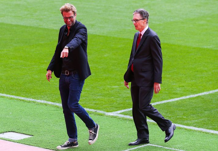 Jürgen Klopp, knattspyrnustjóri Liverpool, og John W. Henry, eigandi félagsins. Jamie Carragher segir engan vafa liggja á því hvor þeirra sé kóngurinn hjá Liverpool.