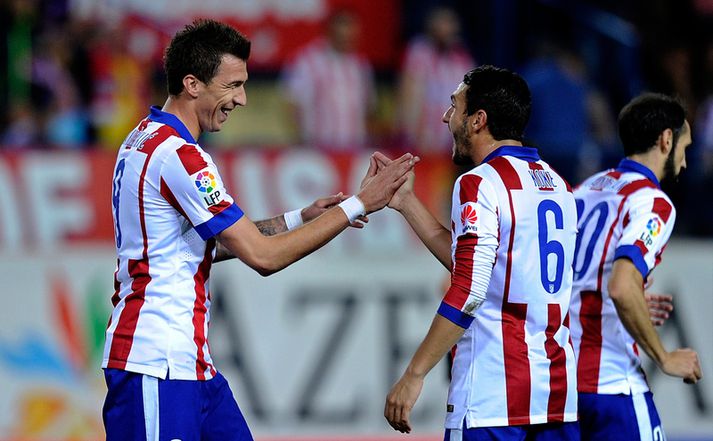 Mandzukic og Koke fagna marki.