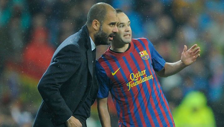 Pep Guardiola, þjálfari Barcelona og Andres Iniesta.