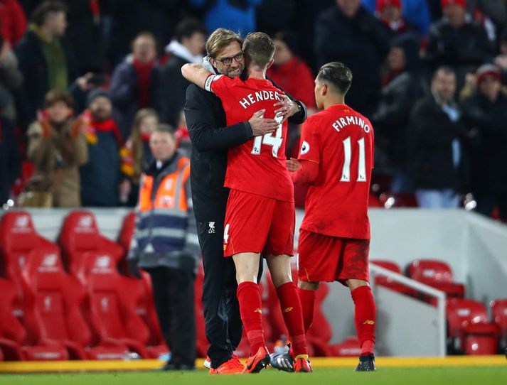 Jordan Henderson og Jürgen Klopp eftir sigurinn á Tottenham.