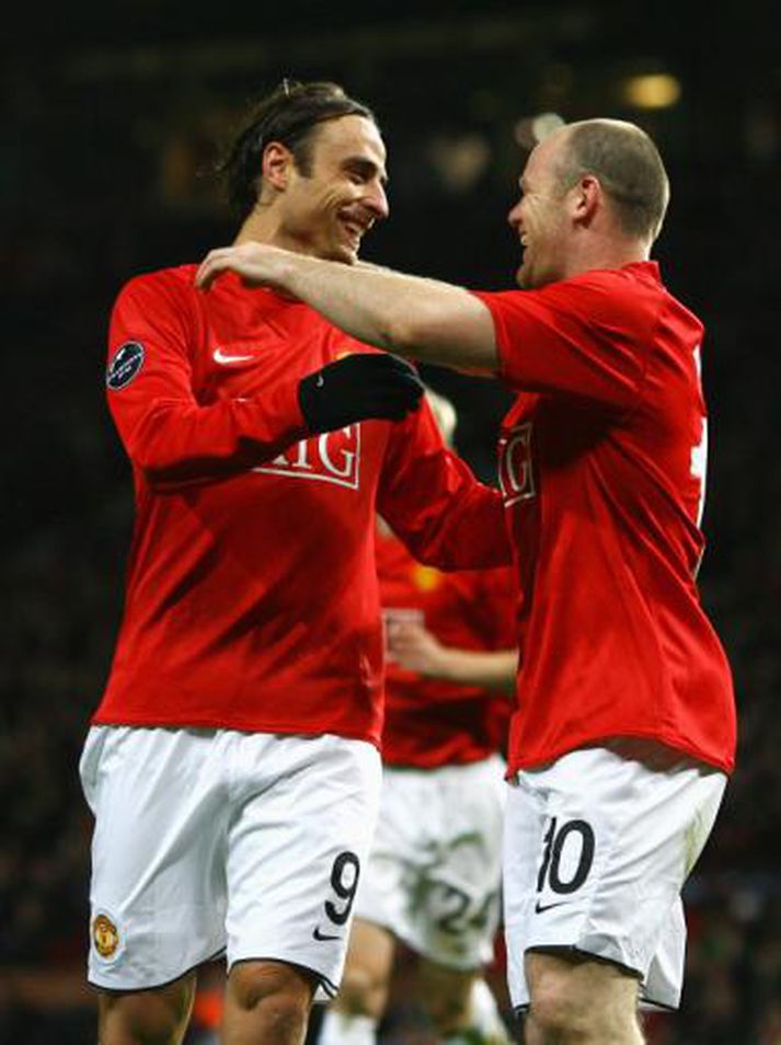 Markaskorararnir Berbatov og Rooney.