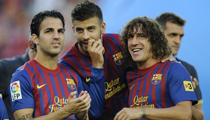 Puyol, lengst vil vinstri, ásamt Cesc Fabregas og Gerard Pique.