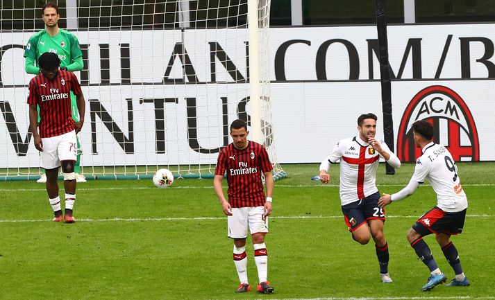 Genoa fagnaði sigri gegn AC Milan í dag.