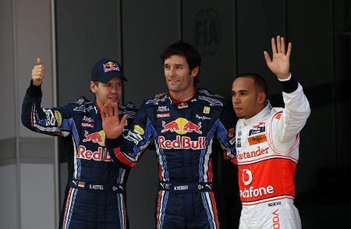 Sebastian Vettel, Mark Webber og Lewis Hamilton fagna árangrinum í dag.