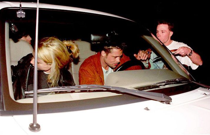 February 19, 1995: Brad Pitt Avoids Photographers With His Mystery Date At The Buffalo Club In Beverly Hills, California. (Photo By David Keeler/Getty Images) 96619/42271/Brad Pitt