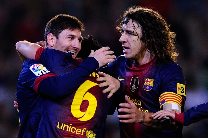 Messi, Xavi og Puyol.