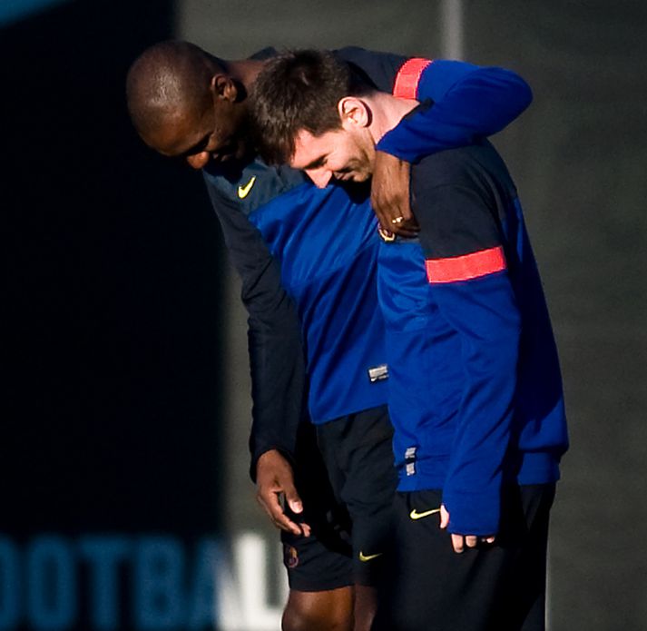 Eric Abidal og Lionel Messi á æfingu með Barcelona.