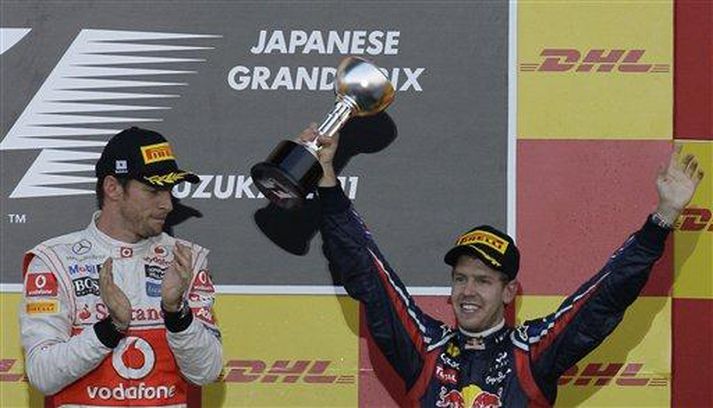 Jenson Button og Sebastian Vettel á verðlaunapallinum í Japan í dag.