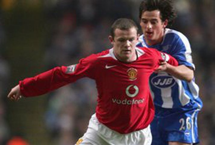 Wayne Rooney kom United yfir gegn Wigan